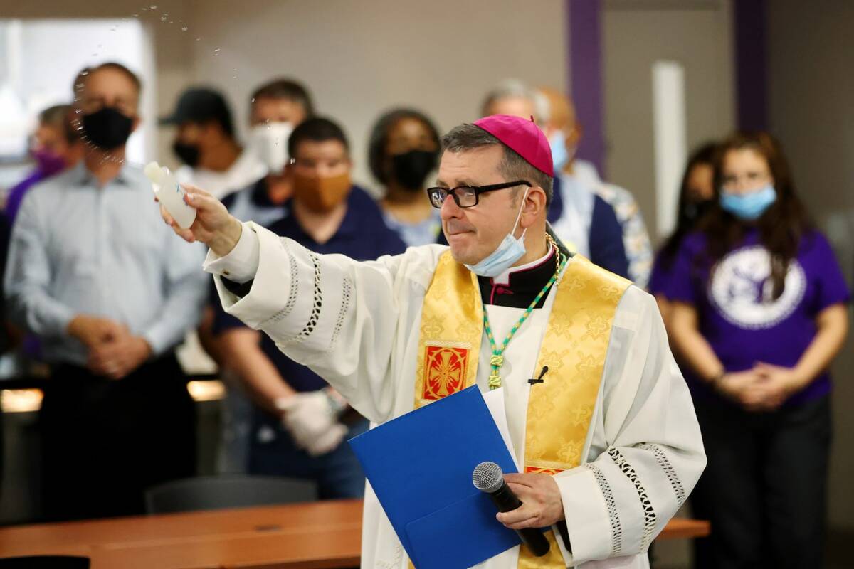 Most Reverent Gregory Gordon, auxiliary bishop of the Diocese of Las Vegas, blesses the St. Vin ...