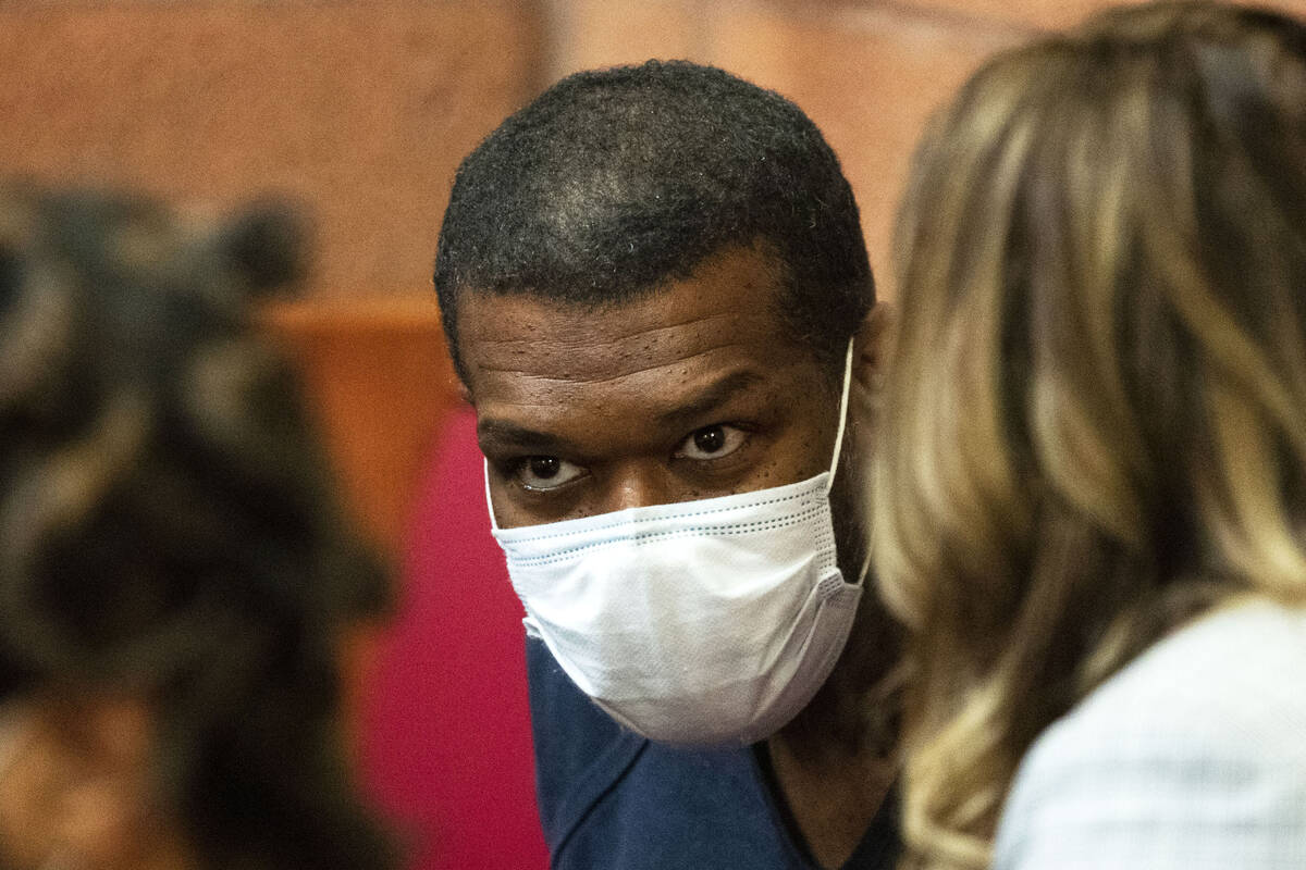 Willis Davis listens to his attorney, Betsy Allen, at North Las Vegas Justice Court on Thursday ...