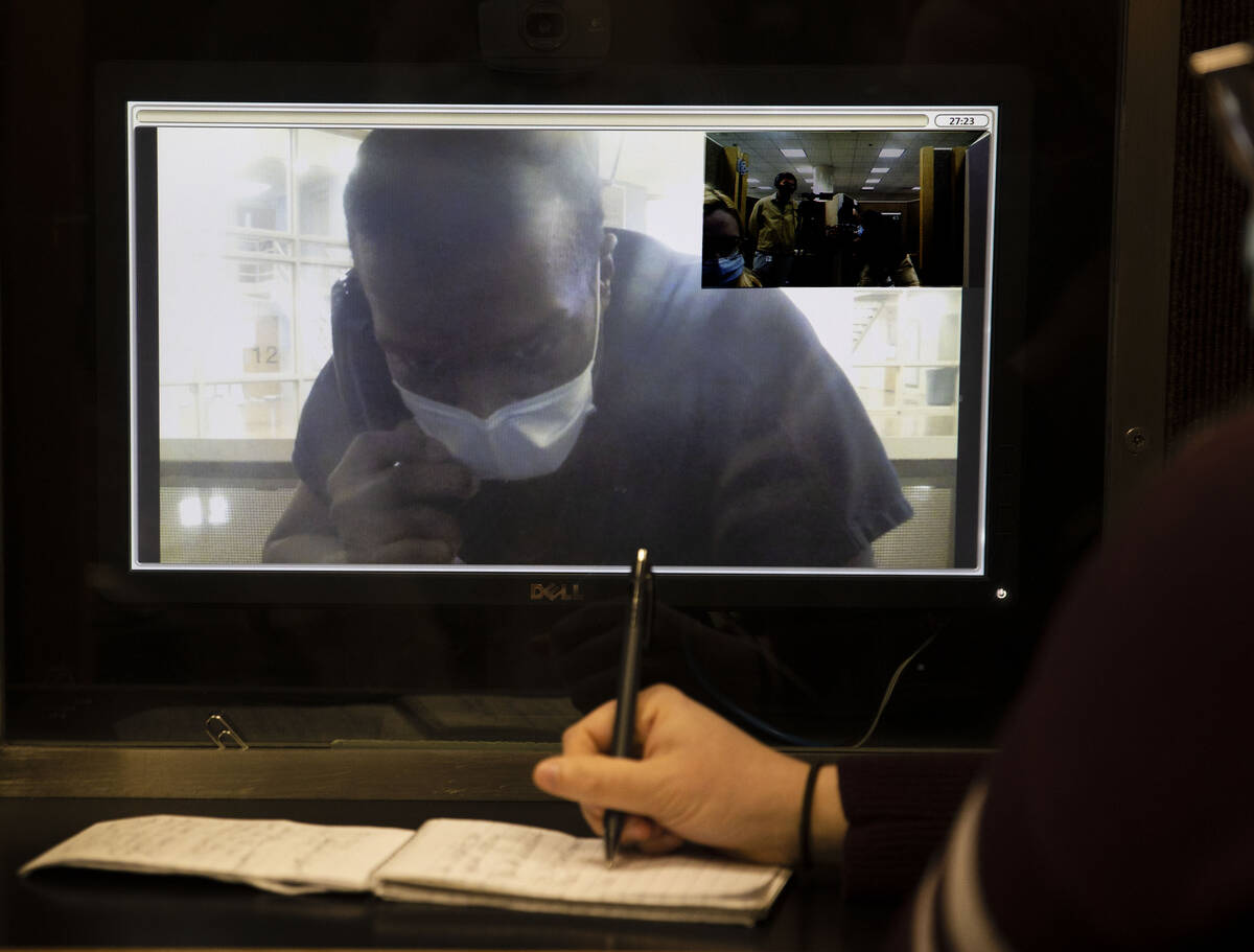Willis Davis conducts an interview via video chat from the Clark County Detention Center on Wed ...