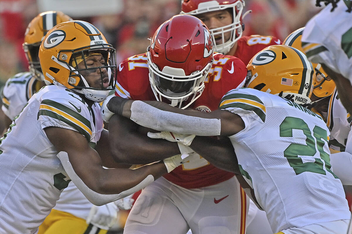 Green Bay Packers safety Adrian Amos (31) and free safety Darnell Savage (26) tackle Kansas Cit ...