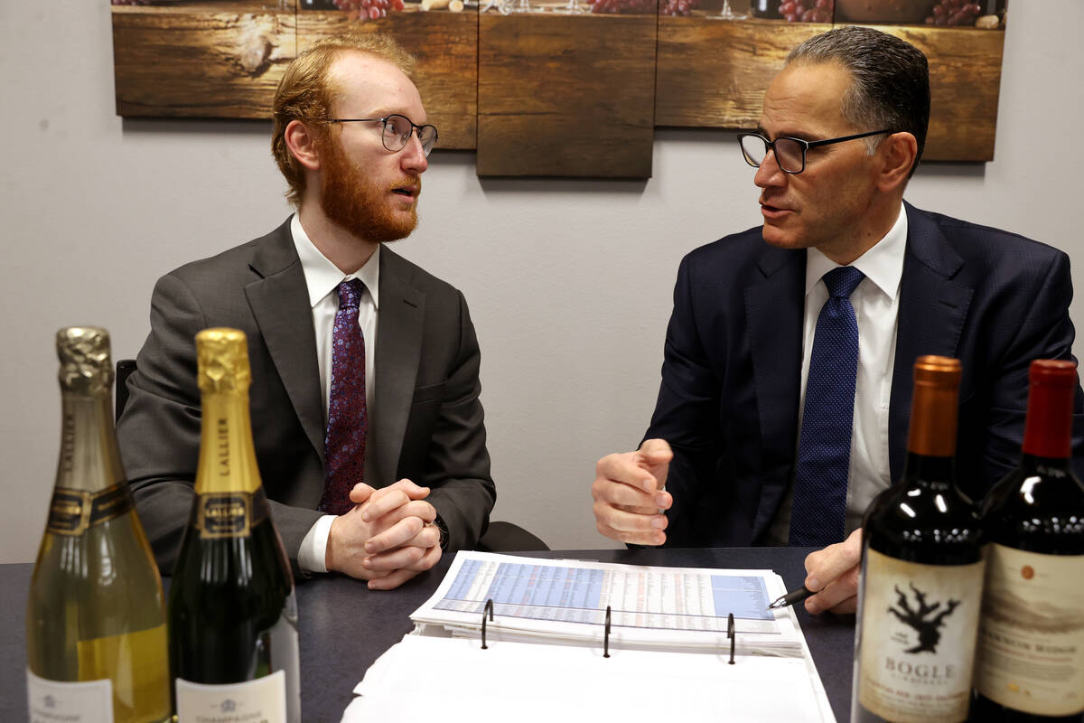 UNLV student Nikolas Fava, left, shadows Gary Charmel, who works in beverage wholesale, at John ...