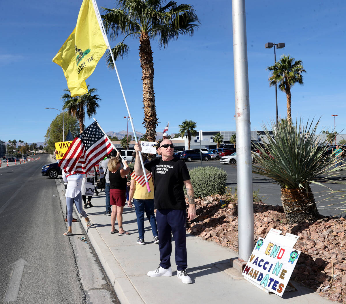 Protesters, including James Butler of Las Vegas, right, at Southern Nevada Health District in L ...