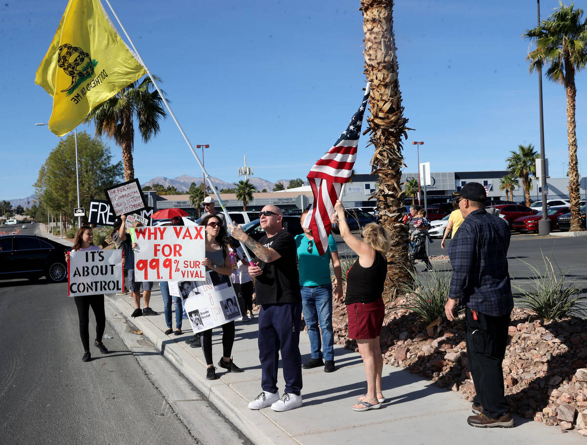 Protesters, including James Butler of Las Vegas, center, at Southern Nevada Health District in ...
