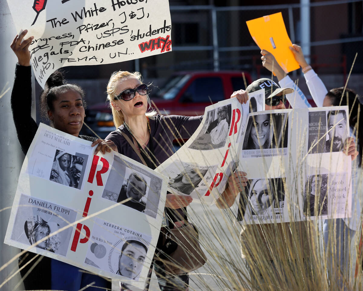 Protesters, including Darricka Ransey of North Las Vegas, left, and a woman who only gave her n ...