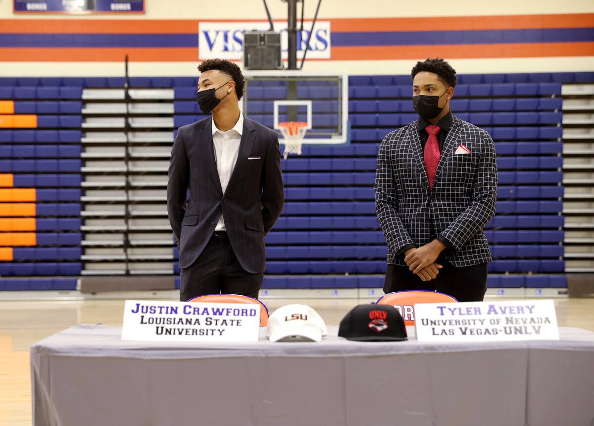 Justin Crawford, left, and Tyler Avery during a signing ceremony at Bishop Gorman High School i ...