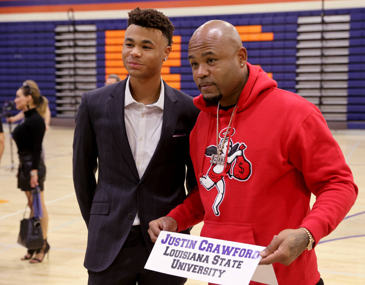 Justin Crawford poses with his father, former Major League Baseball player Carl Crawford, after ...