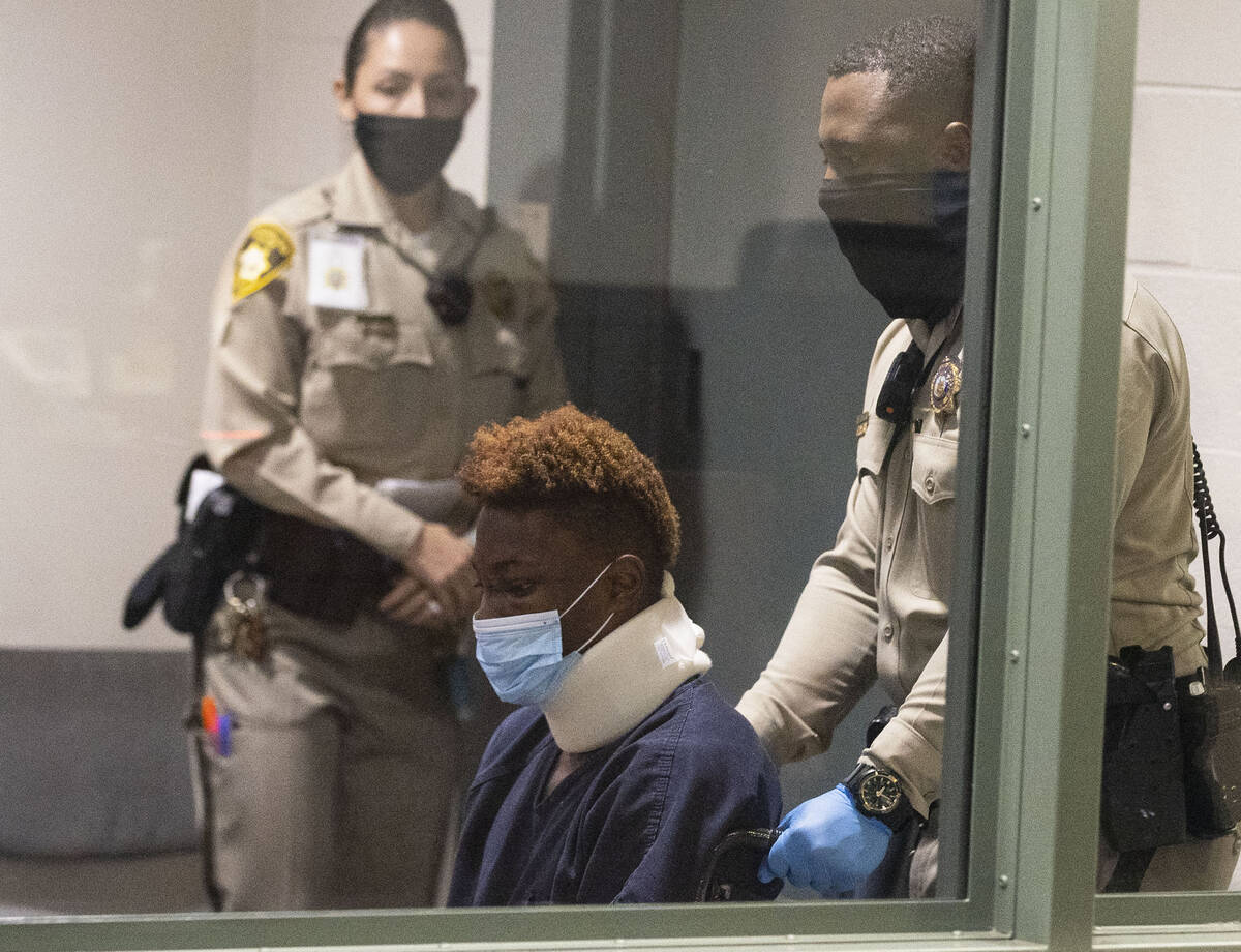 Former Raiders wide receiver Henry Ruggs, accused of DUI resulting in death, is led into the co ...