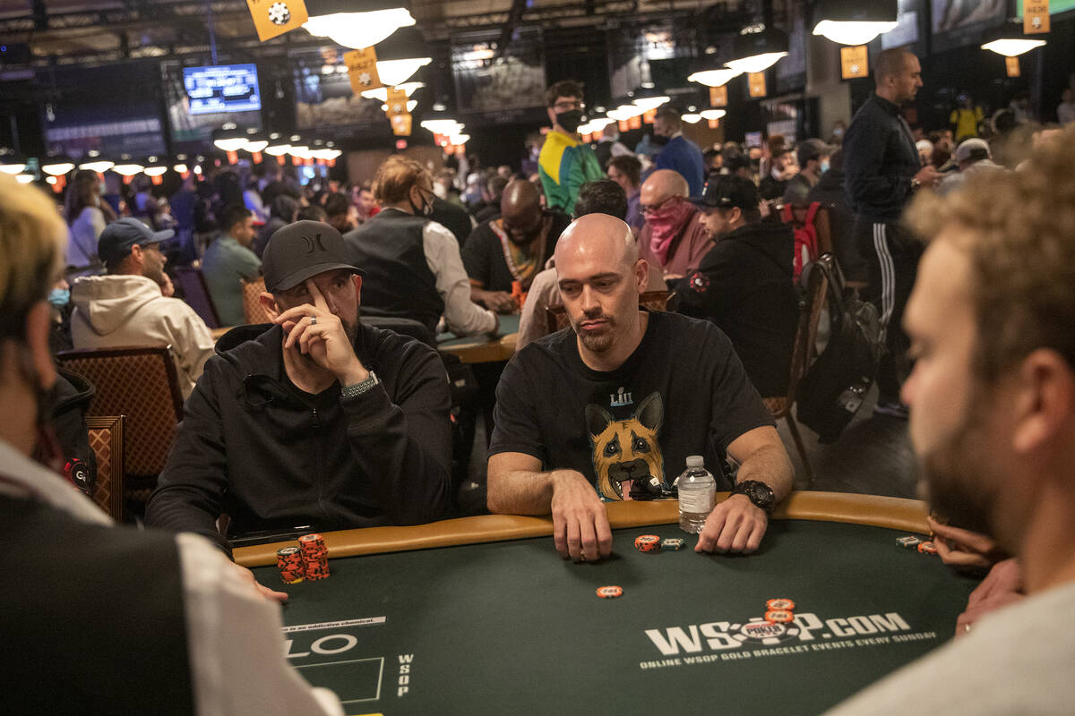 Joe Marincola, center right, handles his chips during the World Series of Poker Main Event at t ...