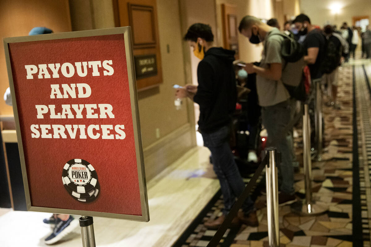 The line for payouts extends out the door and down the hallway during the World Series of Poker ...
