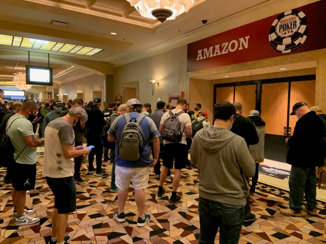 Players wait to return from a break on Day 3 of the World Series of Poker Main Event on Thursda ...
