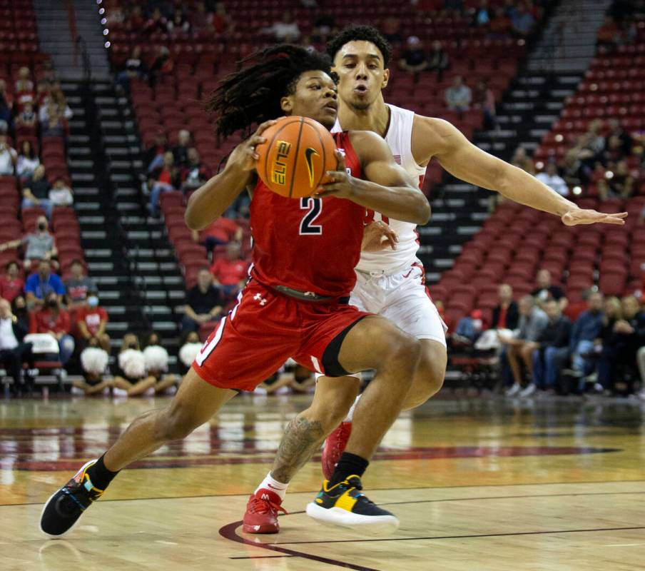 Gardner Webb Runnin Bulldogs guard Jordan Sears (2) dribbles up the court followed by UNLV Rebe ...