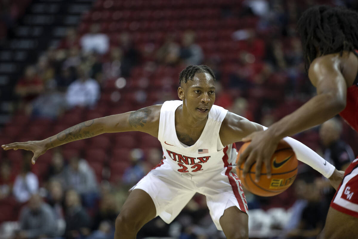 UNLV Rebels guard Josh Baker (22) eyes the ball as Gardner Webb Runnin Bulldogs guard Jordan Se ...