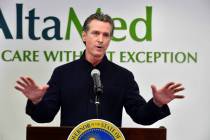 California Gov. Gavin Newsom speaks during a press conference at a COVID-19 vaccination site at ...