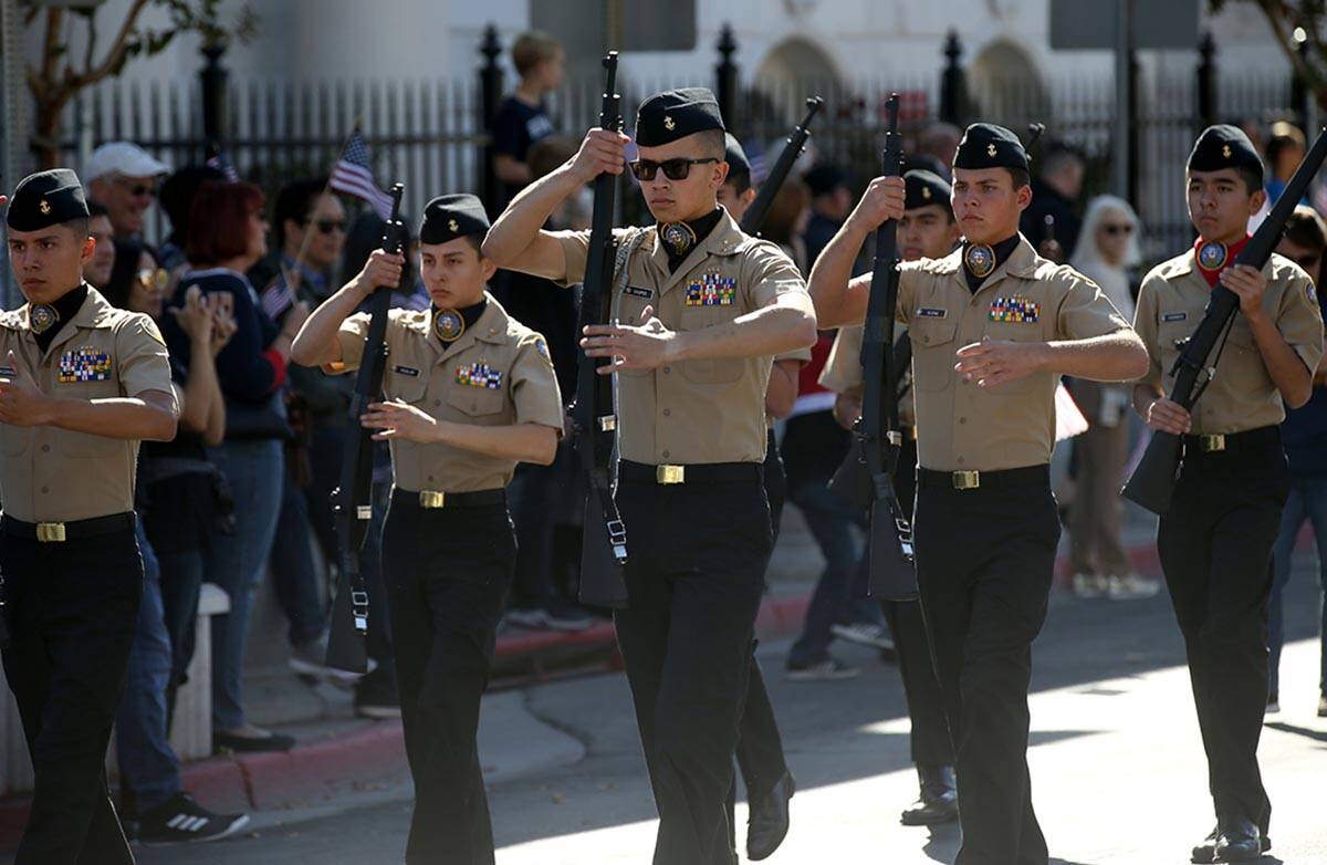 Centennial High School Navy Junior ROTC marches in the Veterans Day Parade in downtown Las Vega ...