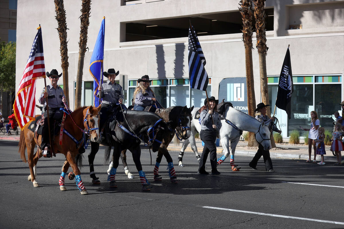The Boulder City Mounted Posse participates during the Veterans Day parade on 4th Street in dow ...