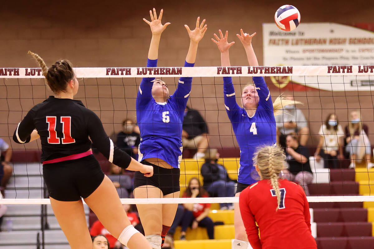 Liberty's Brooklyn Slater (11) hits the ball past Sierra Vista's Teanna Sodaria (6) and Maysen ...