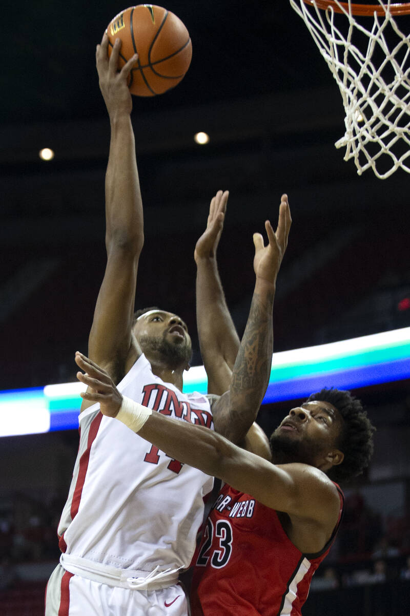 UNLV Rebels forward Royce Hamm Jr. (14) attempts a point as Gardner Webb Runnin Bulldogs guard ...