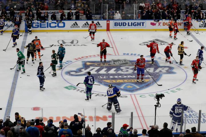 Players warm up before the Skills Competition, part of the NHL All-Star weekend, Friday, Jan. 2 ...