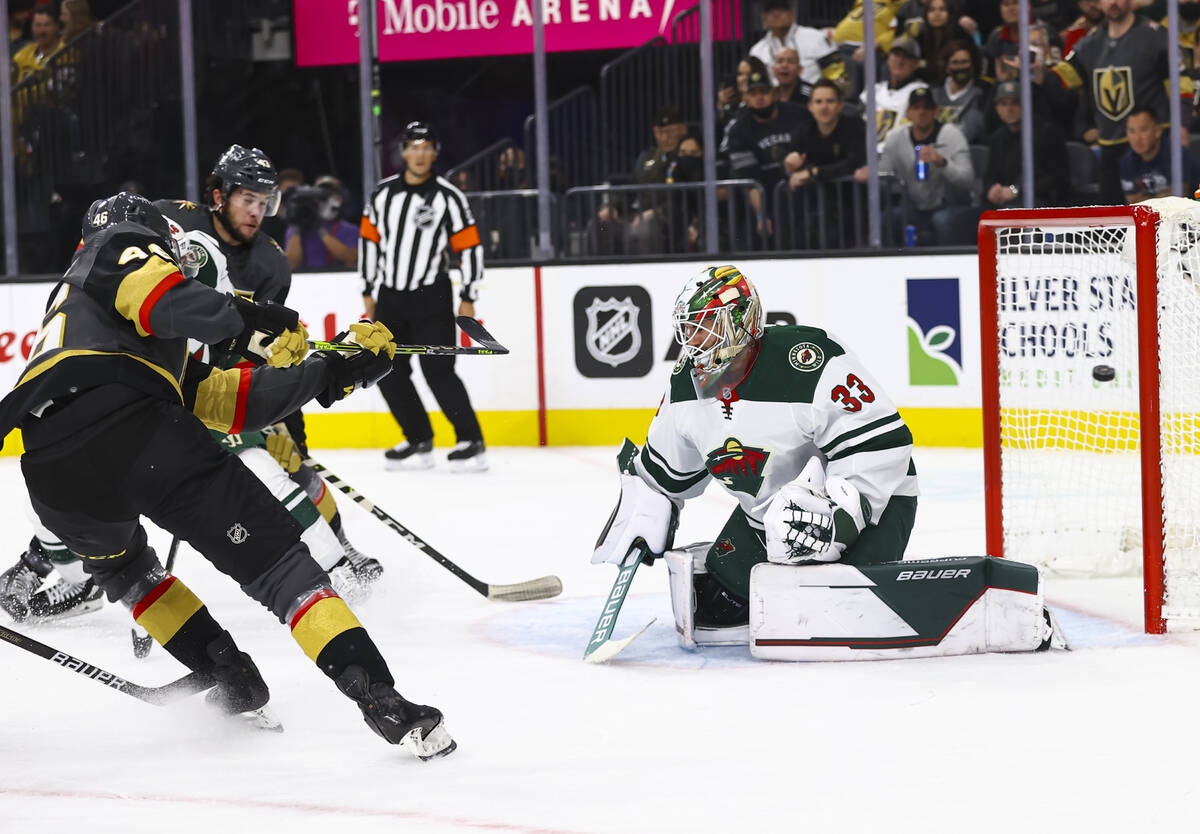 Golden Knights right wing Jonas Rondbjerg (46) scores a goal past Minnesota Wild goaltender Cam ...