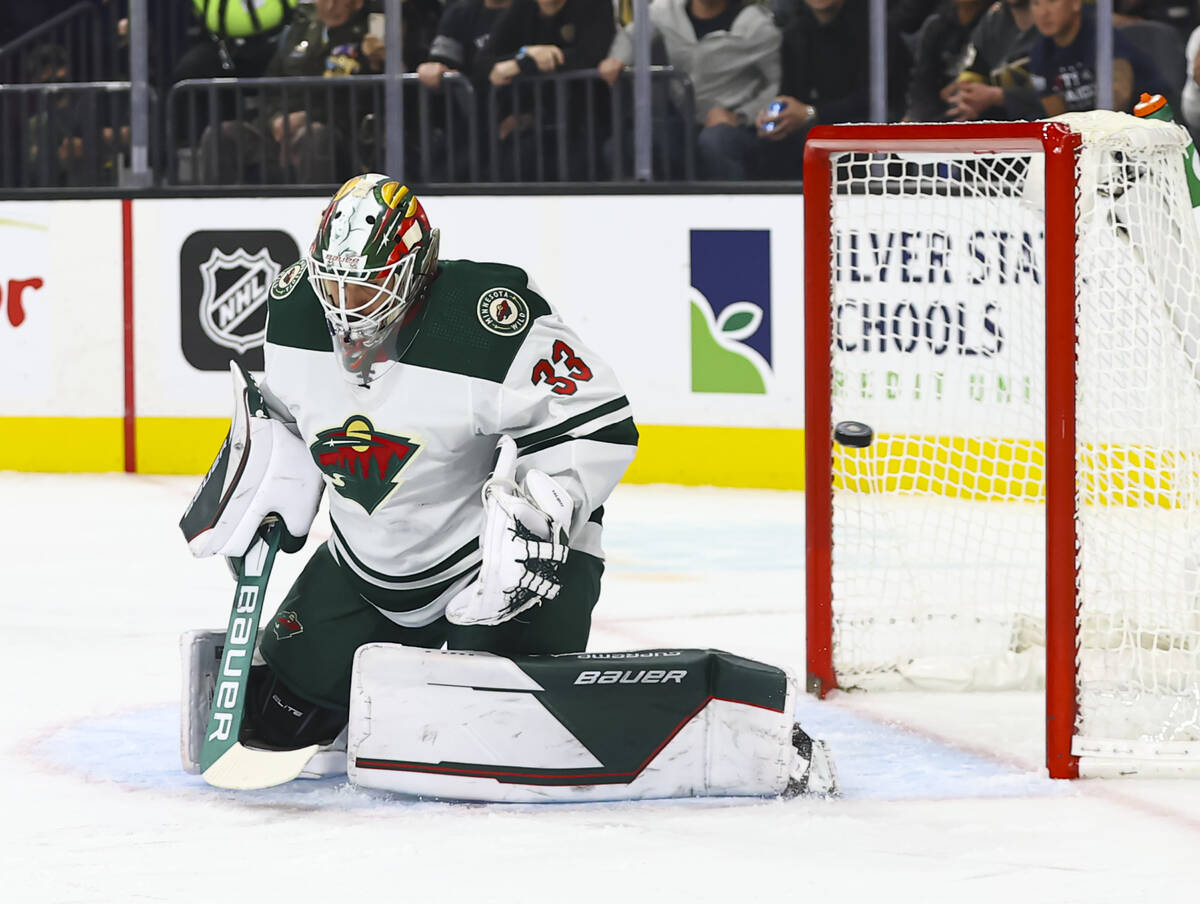 Golden Knights center Paul Cotter, not pictured, sends the puck past Minnesota Wild goaltender ...