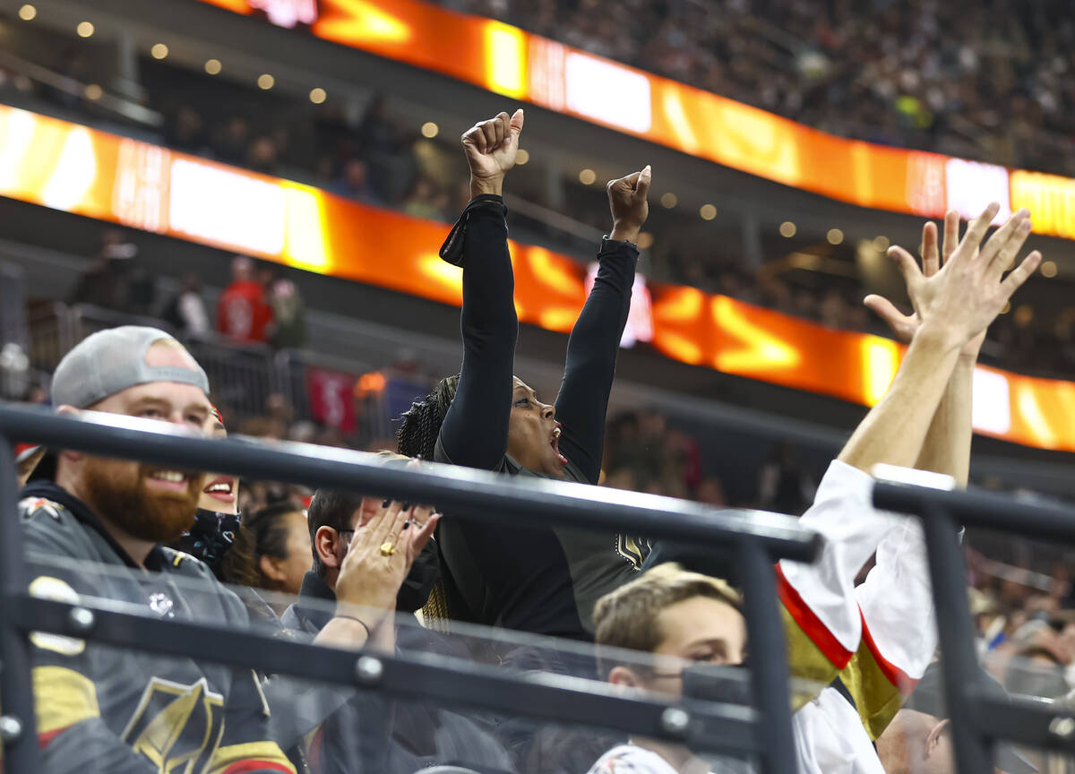 Golden Knights fans celebrate center Paul Cotter’s first ever NHL goal during the first ...
