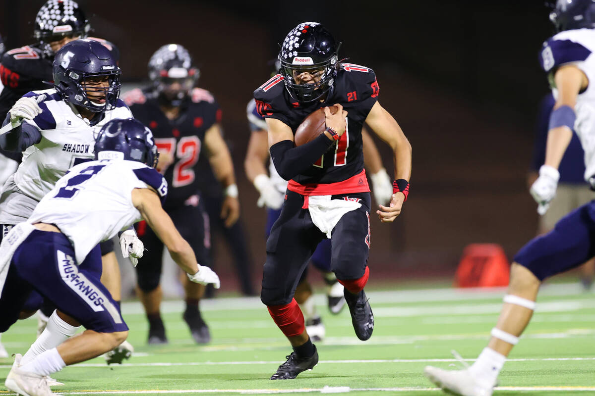 Las Vegas' quarterback Elijah Espinoza (11) runs the ball against Shadow Ridge in the first hal ...