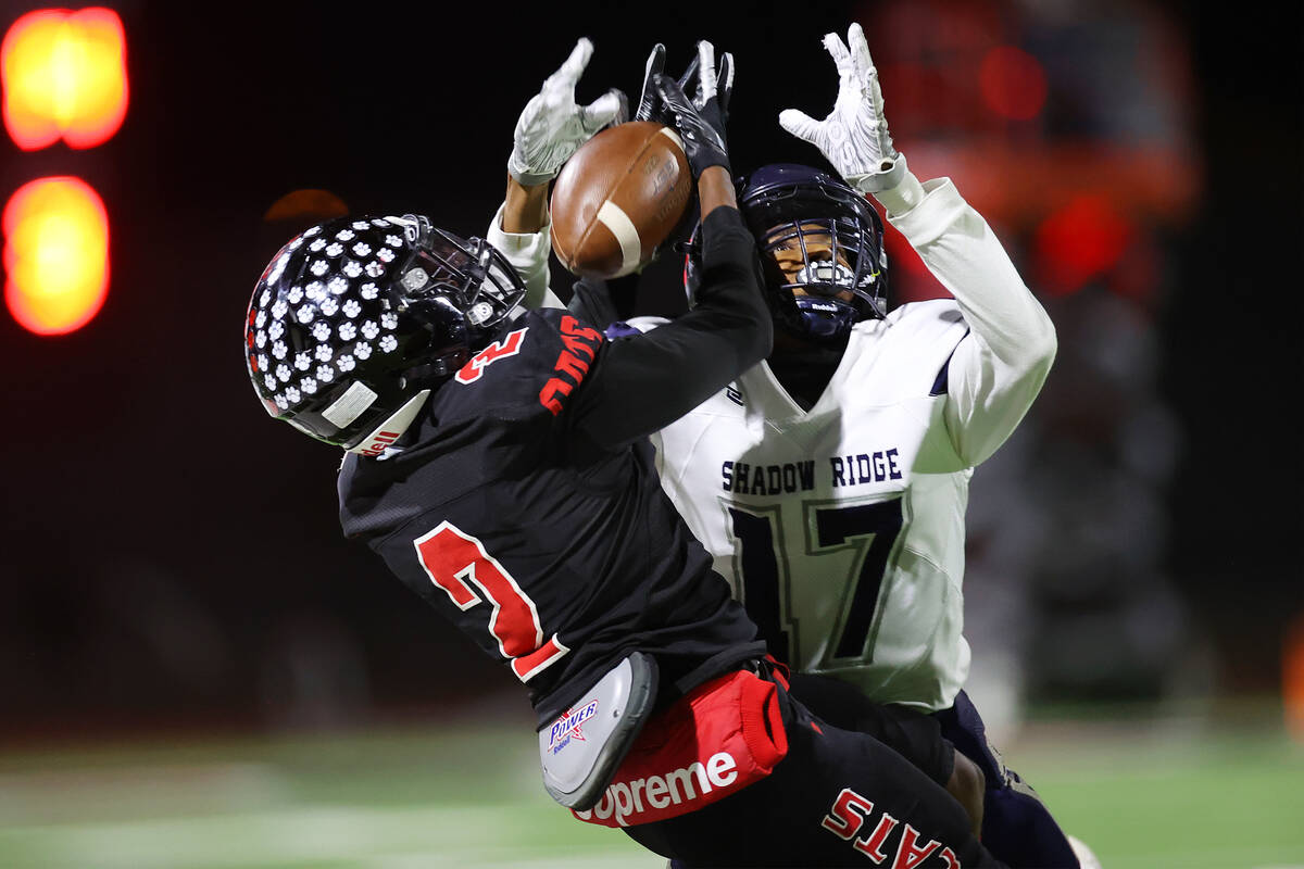 Las Vegas' Bryan Inmon (2) makes a catch under pressure from Shadow Ridge's Bryson Wilson (17) ...