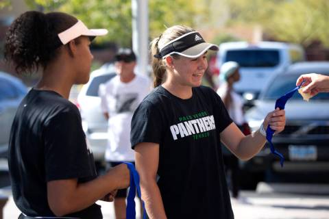 Palo Verde's Cambell Ricci accepts a state title medal alongside Paisha Douglas for winning the ...