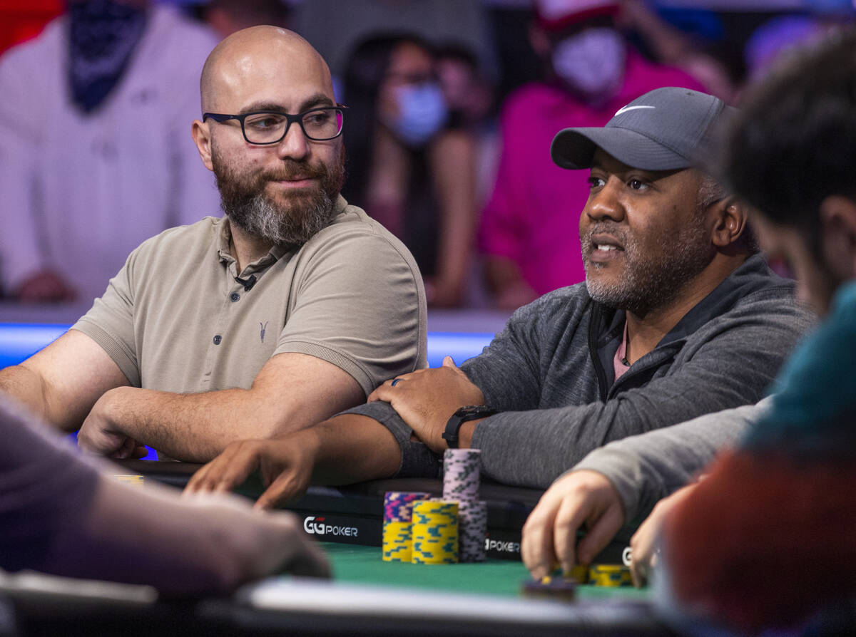 Ozgur Secilmis looks to George Holmes at the final table for the $10,000 buy-in Main Event at t ...