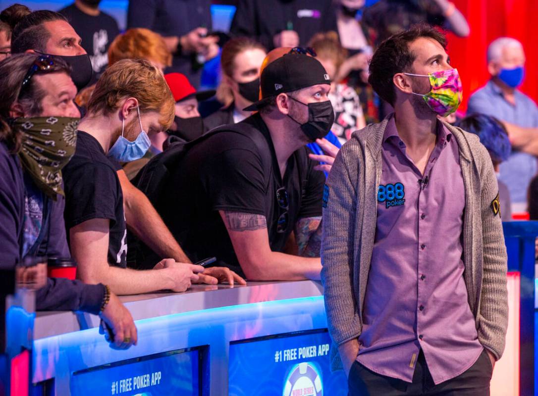 Koray Aldemir takes a moment with his gallery with three players remaining at the final table f ...