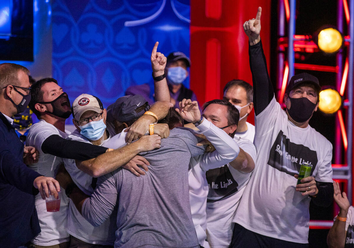 The gallery congratulates George Holmes after eliminating Jack Oliver with just two players rem ...