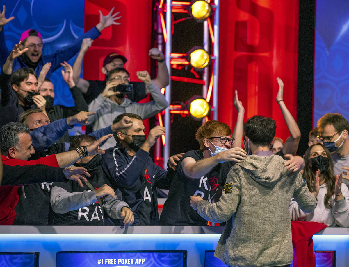Koray Aldemir celebrates his win over George Holmes with his gallery at the final table for the ...