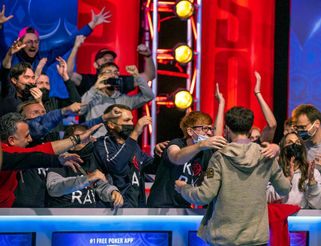 Koray Aldemir celebrates his win over George Holmes with his gallery at the final table for the ...