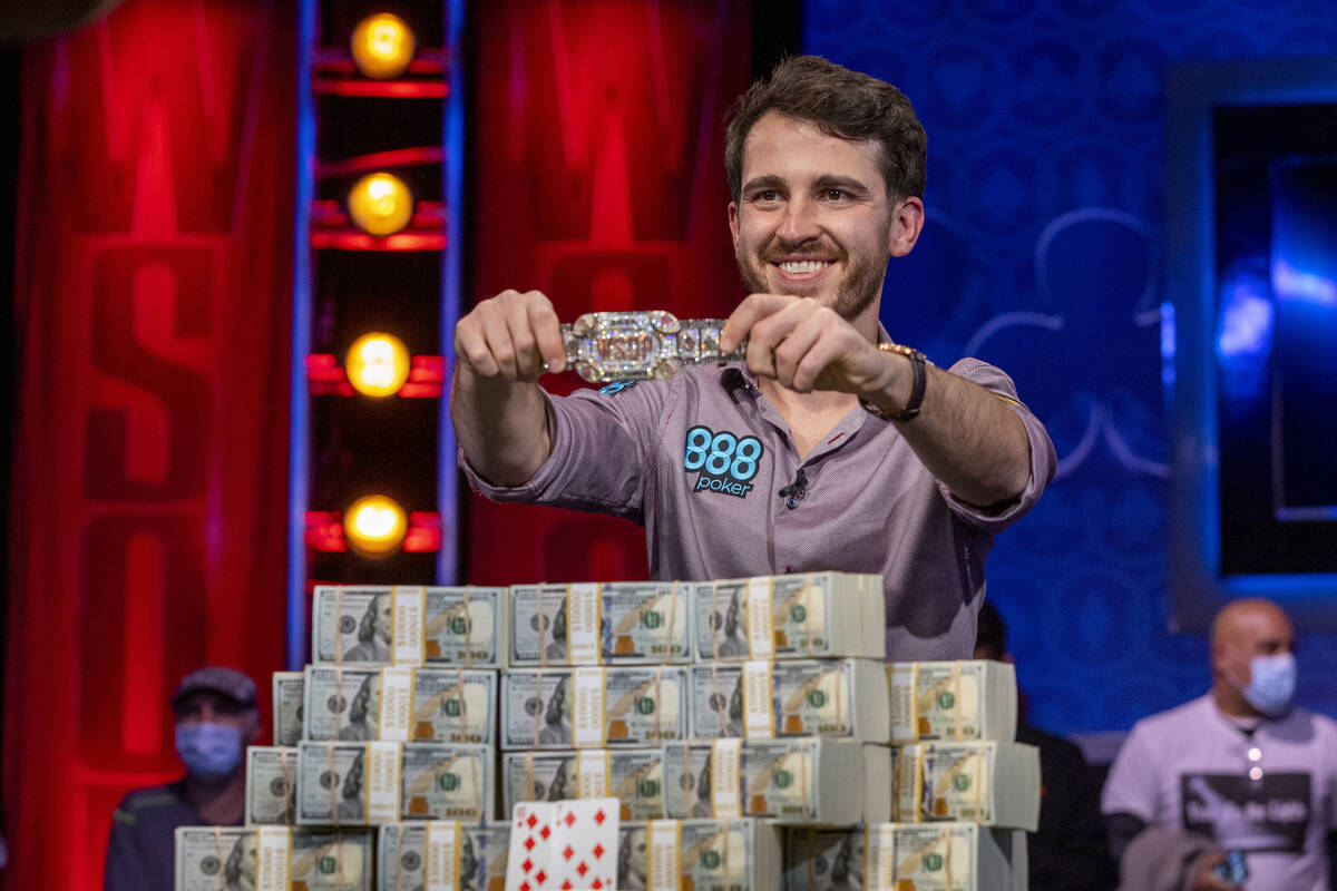 Winner Koray Aldemir with his bracelet and stacks of cash at the final table for the $10,000 bu ...