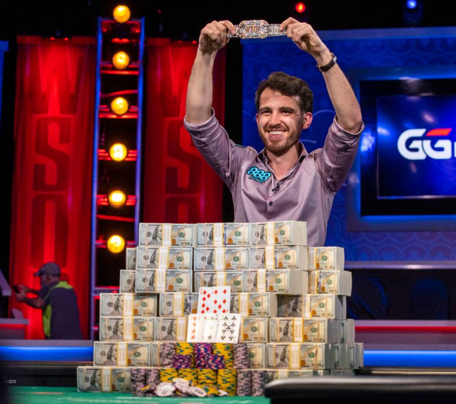 Winner Koray Aldemir with his bracelet and stacks of cash at the final table for the $10,000 bu ...