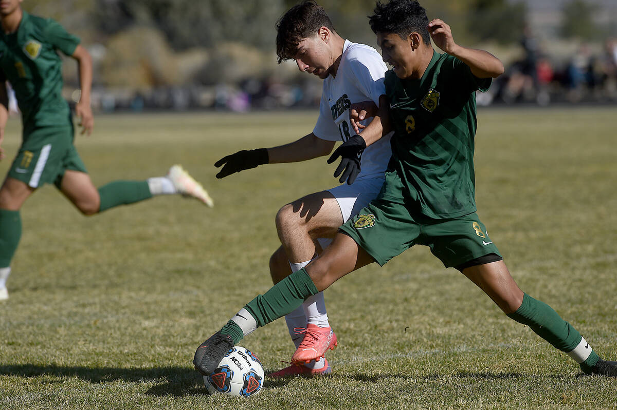 Palo Verde's Yuval Cohen battles Hug's Alan Gutierrez for the ball during the NIAA boy's soccer ...