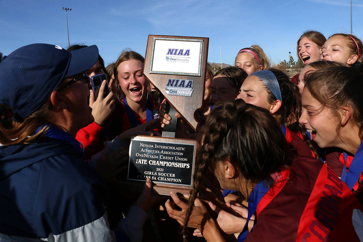 The Coronado girls soccer team celebrates its NIAA 5A Nevada State Soccer Championship over Fai ...