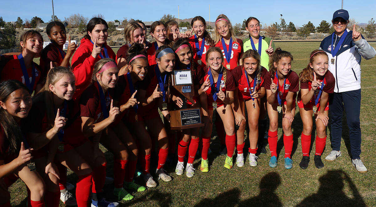 The Coronado girls soccer team celebrates their NIAA 5A Nevada State Soccer Championship over F ...