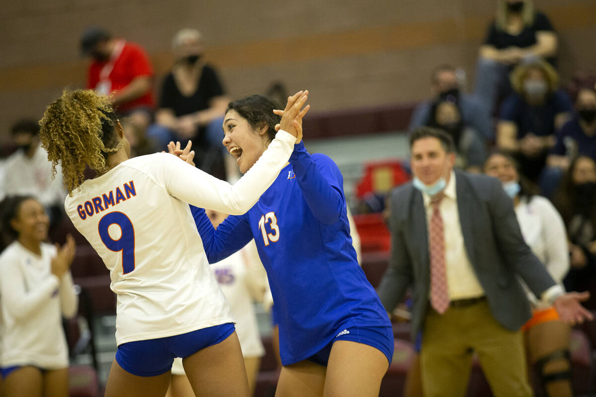 Bishop Gorman's Imani Dambreville (9) and Tatum Thompson (13) celebrate a point during the Clas ...