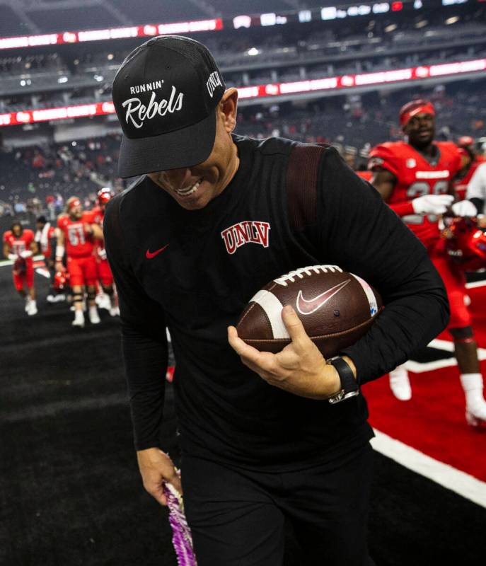 UNLV head coach Marcus Arroyo leaves the field after beating Hawaii Warriors during an NCAA foo ...