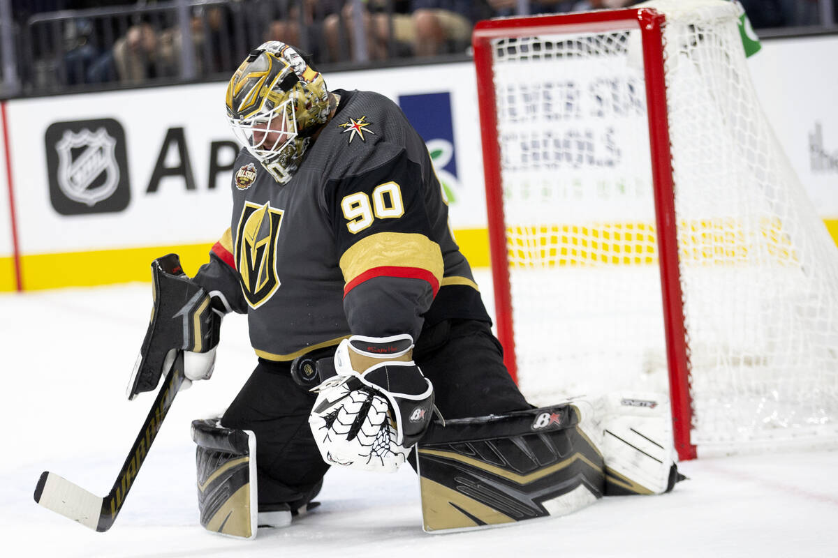 Golden Knights goaltender Robin Lehner (90) saves a shot on goal during the second period of a ...