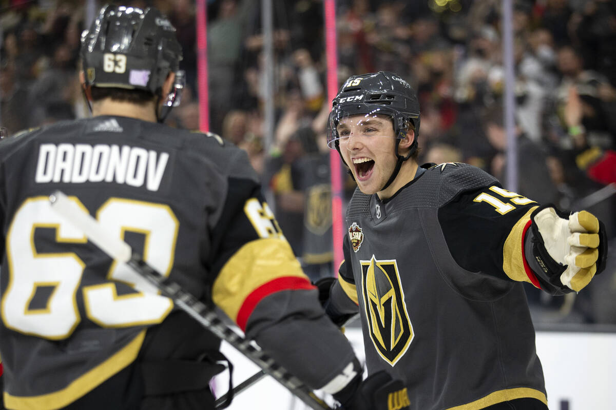 Golden Knights center Jake Leschyshyn (15) celebrates his first ever NHL goal with right wing E ...