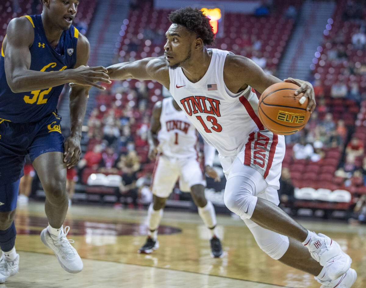UNLV Rebels guard Bryce Hamilton (13) drives the lane against California Golden Bears guard Jal ...