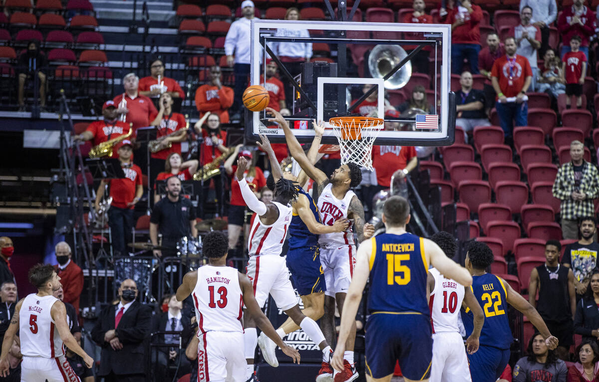 UNLV Rebels forward Royce Hamm Jr. (14) blocks a shot by California Golden Bears guard Joel Bro ...