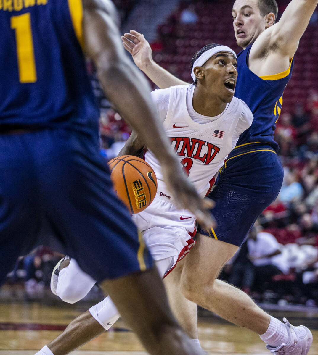 UNLV Rebels forward Donovan Williams (3) goes under the defense of California Golden Bears forw ...