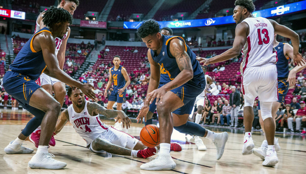 UNLV Rebels forward Royce Hamm Jr. (14) looks to a loose ball eyed by California Golden Bears f ...