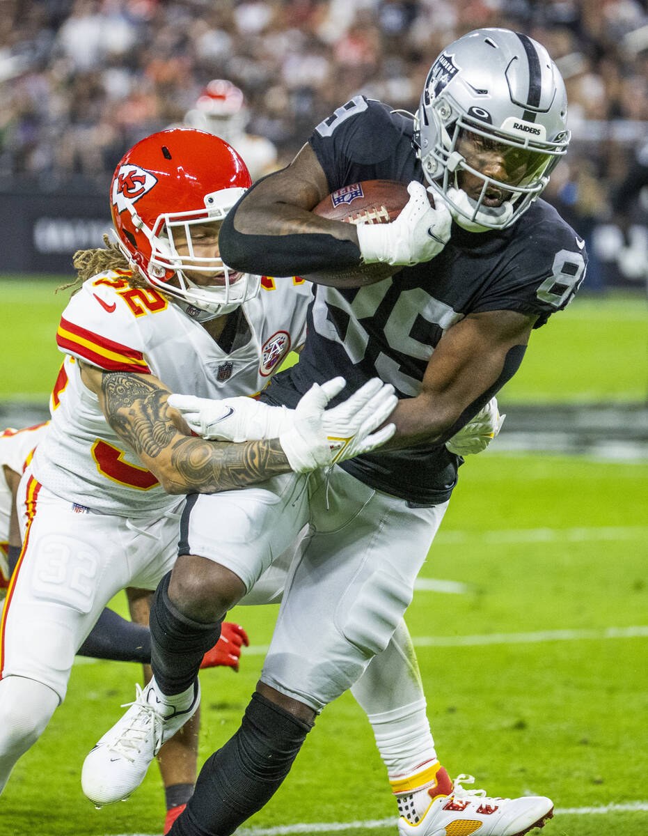 Raiders wide receiver Bryan Edwards (89) attempts to break tackle by Kansas City Chiefs free sa ...