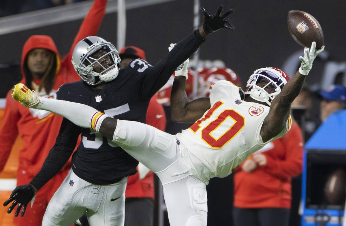 Kansas City Chiefs wide receiver Tyreek Hill (10) dives to try and make a catch past Raiders de ...