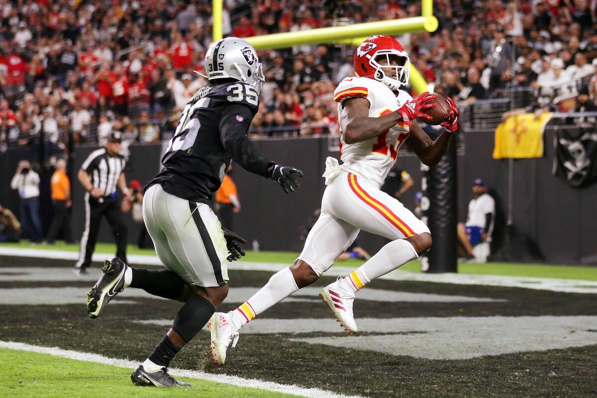 Kansas City Chiefs wide receiver Byron Pringle (13) makes a touchdown catch under pressure from ...