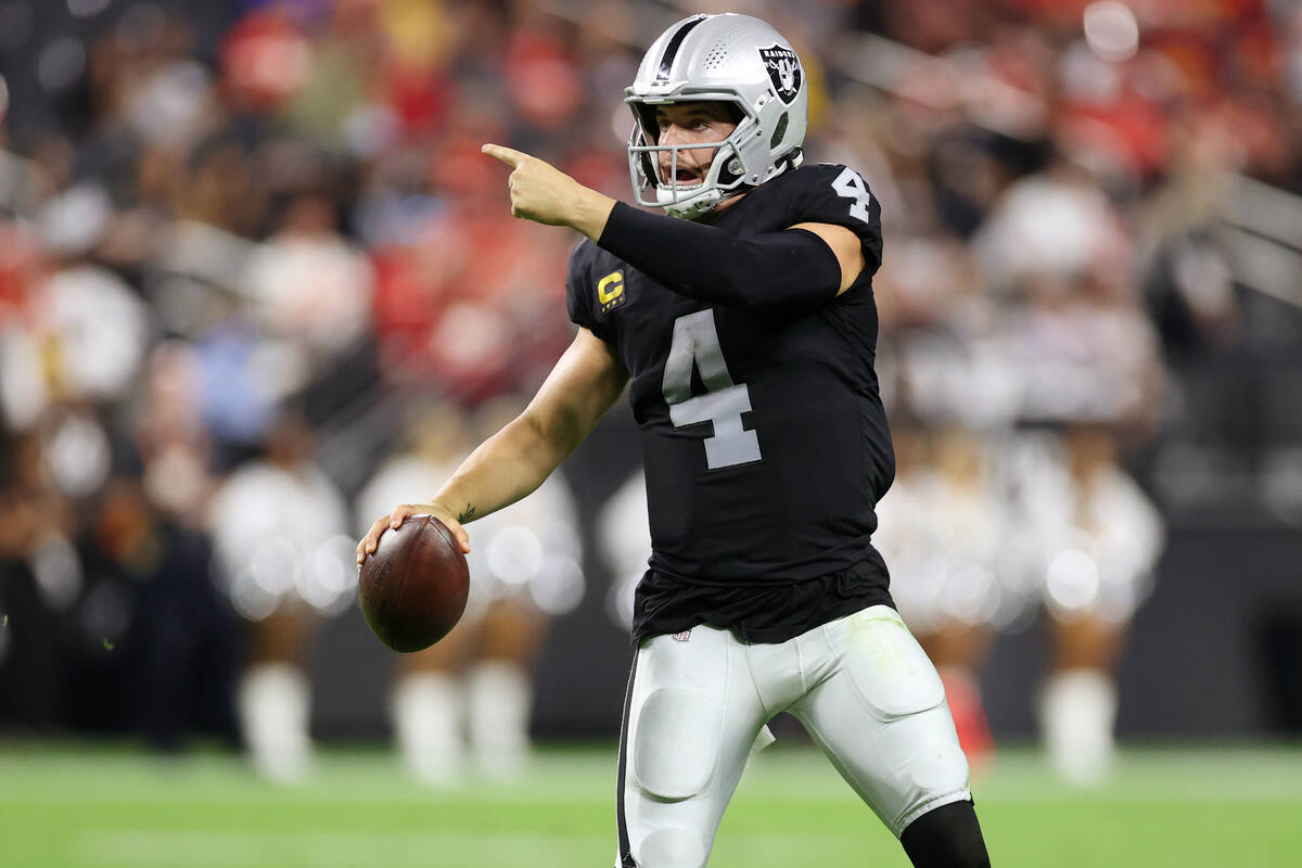 Raiders quarterback Derek Carr (4) gestures to his team during a fourth down play in the second ...